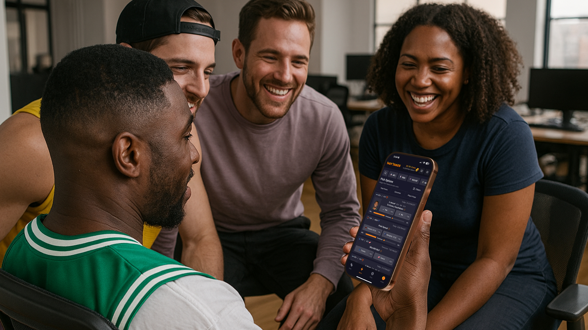 coworkers-laughing-together-and-checking-stats-on-their-office-pools