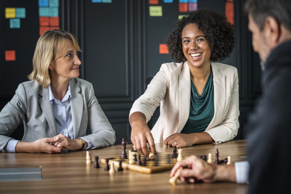 three-business-people-playing-chess