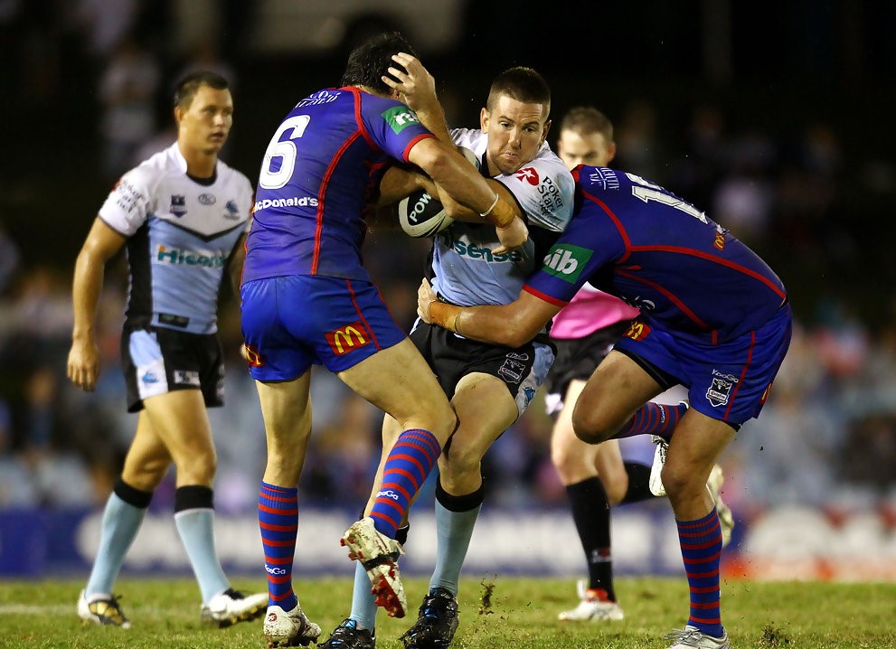 rugby-players-colliding-with-the-ball