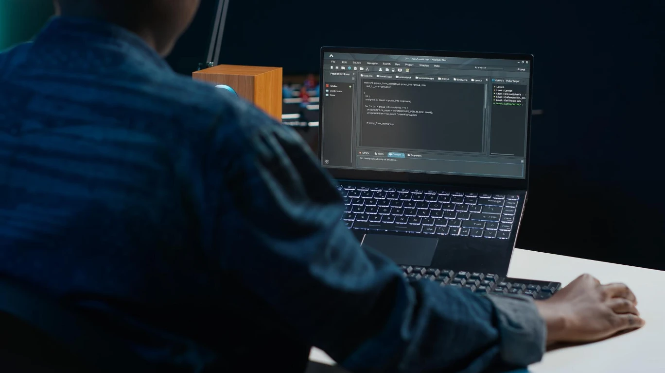 Specialist at a computer checking launch readiness with a turnkey sportsbook software solution
