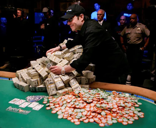 poker-player-with-stack-of-money-and-tokens