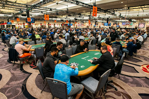 people-playing-poker-rows-of-poker-tables-in-big-room
